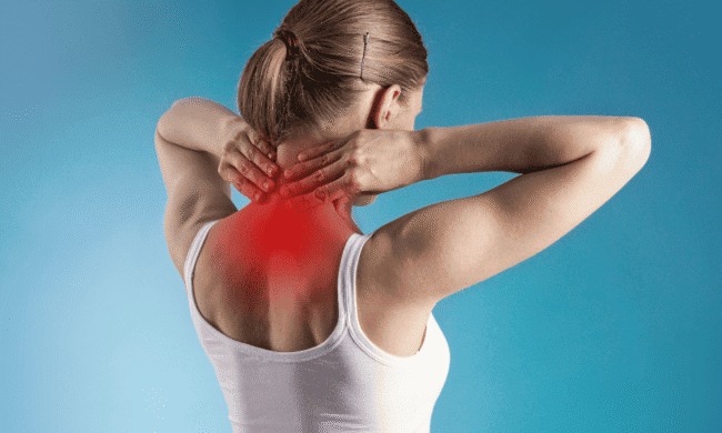 Neck and shoulder pain in woman, experiencing discomfort and stiffness, likely related to sports injury or repetitive strain, at Performance Pain and Sports Medicine.