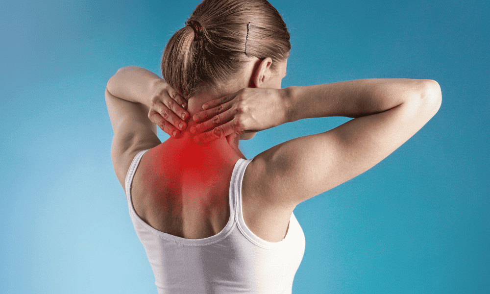Neck and shoulder pain in woman, experiencing discomfort and stiffness, likely related to sports injury or repetitive strain, at Performance Pain and Sports Medicine.