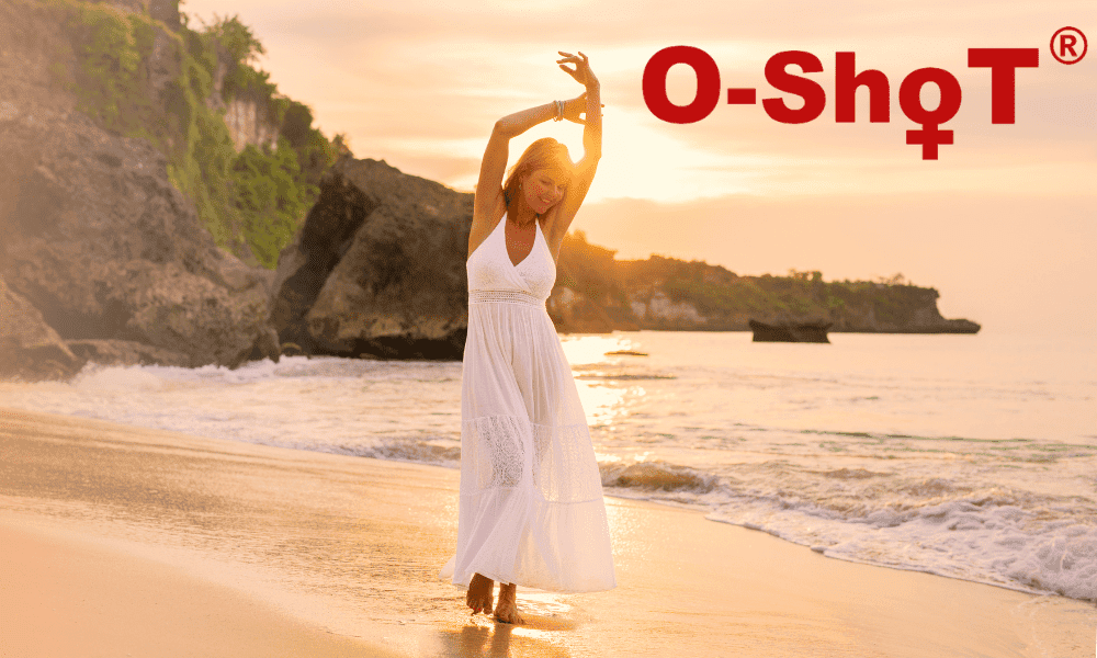 Woman in white dress relaxing on the beach during sunset, emphasizing wellness and pain relief for active lifestyles.