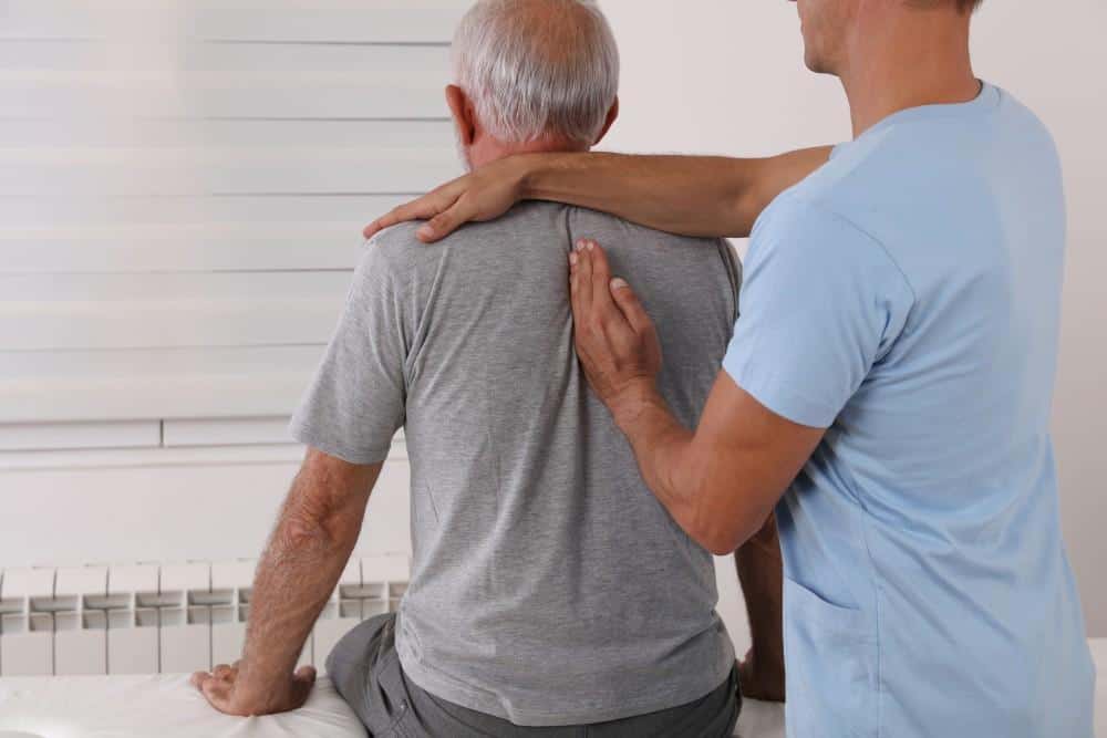 Back pain relief consultation at Performance Pain and Sports Medicine clinic.