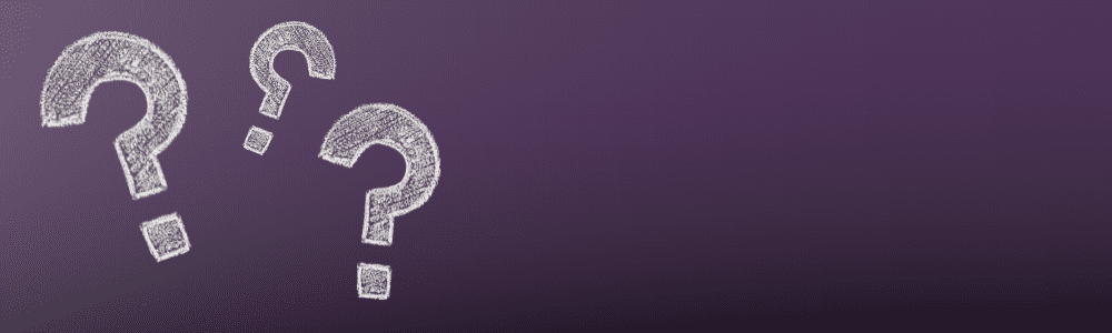 Chalk-drawn question marks on a dark purple background, symbolizing inquiry and solutions in performance pain management and sports medicine.