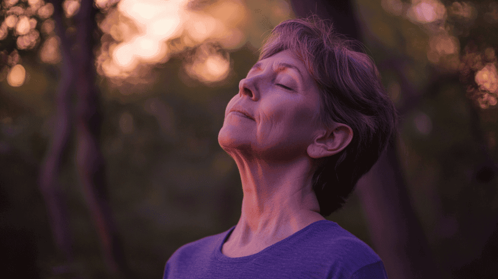 Peaceful elderly woman with eyes closed enjoying nature at sunset, exercising outdoors to relieve pain, improve mobility and enhance overall well-being in sports medicine and performance pain management.