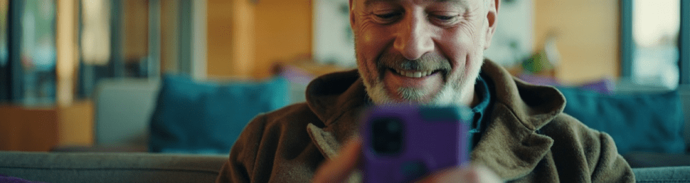 Injured man using smartphone for pain management and sports medicine solutions at Performance Pain clinic.