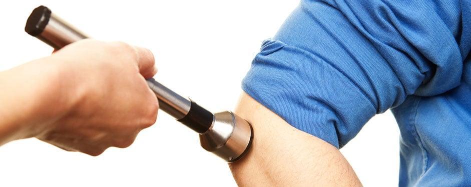 Therapeutic ultrasound treatment for sports medicine and pain relief scene at Performance Pain and Sports Medicine clinic.